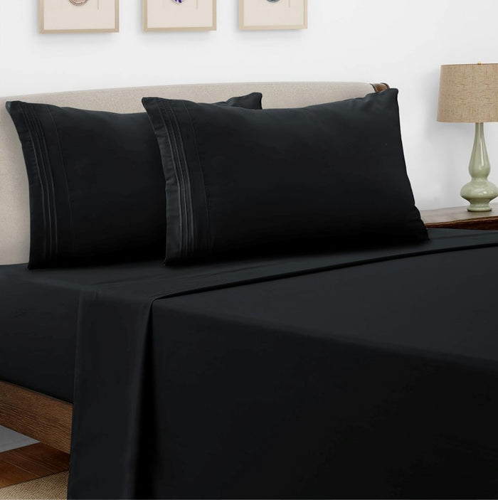 Black microfiber bed sheet set with black embroidery and matching pillowcases