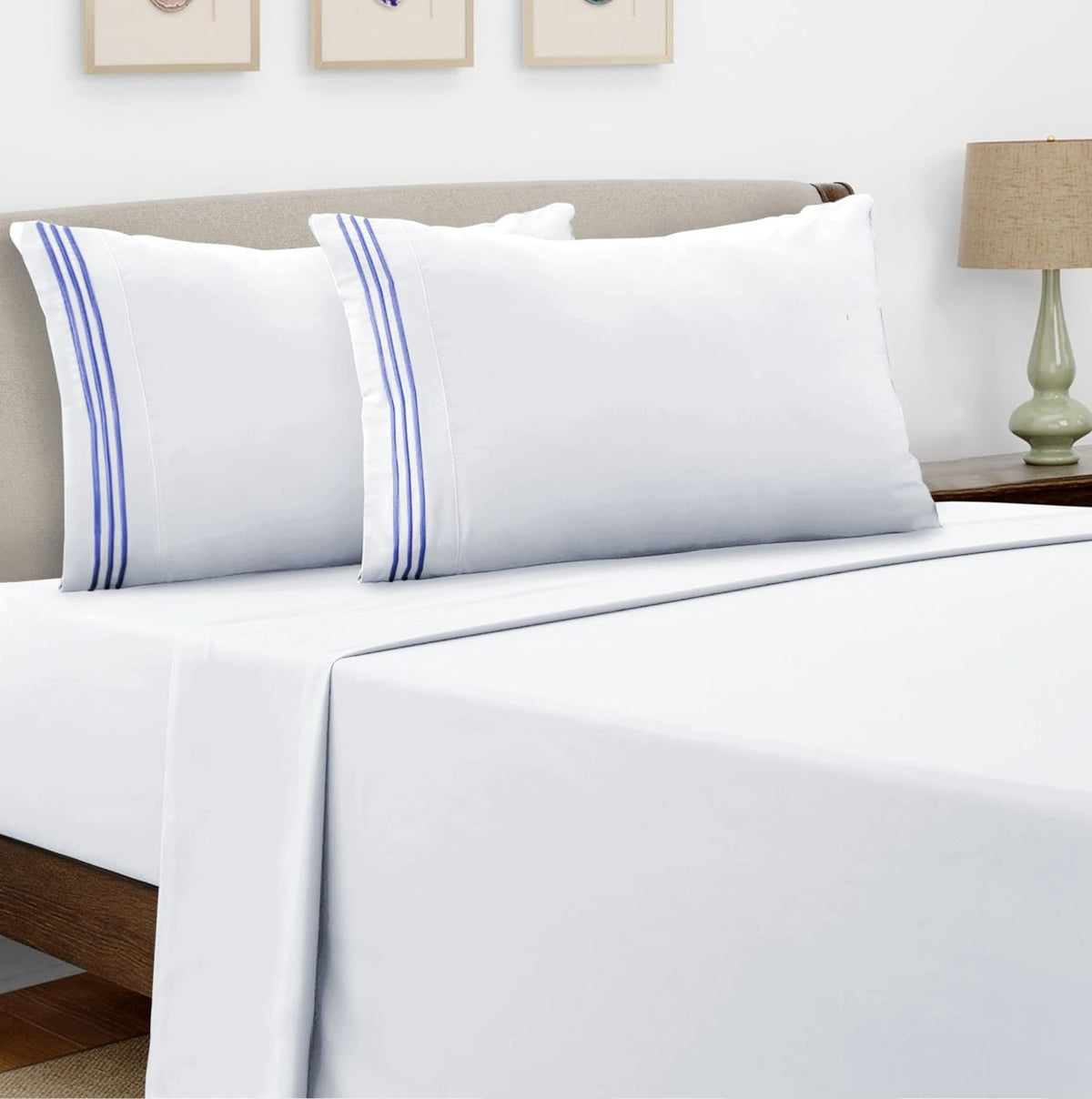 White microfiber bed sheet set with navy embroidered trim and matching pillowcases